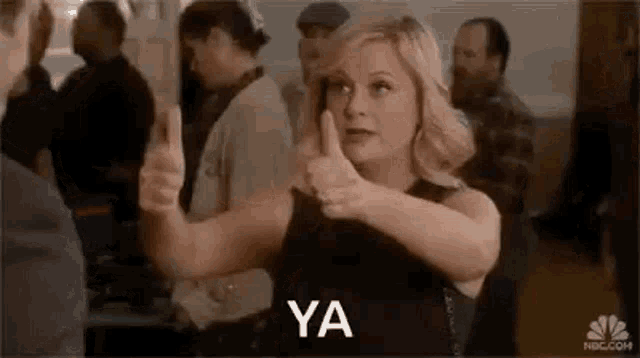 Amy Poehler, an Enneagram type 8, in a gif say YA.