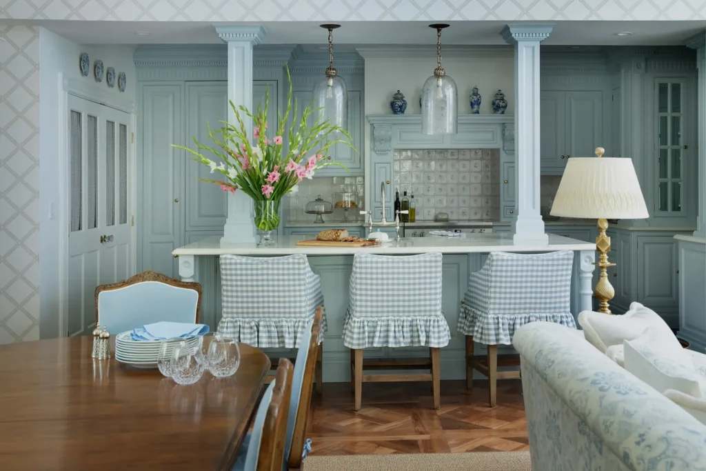 Traditional Enneagram Two interior design with warm blue cabinetry and inviting details