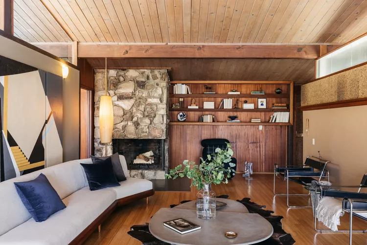 Mid‑century modern Enneagram Eight interior design with wood beams and bold geometric accents