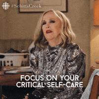 Gif from Schitts Creek saying "Focus on Your Critical Self-care" to emphasize that Enneagram type 2s need to take care of themselves.